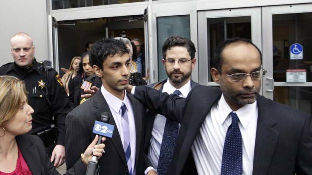 Found guilty of all 15 counts ... Dharun Ravi, centre left.