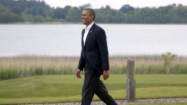 US President Barack Obama walks toward a welcome area during arrivals for the G-8 summit at the Lough Erne Golf Resort in Enniskillen, Northern Ireland on Monday, June 17, 2013.