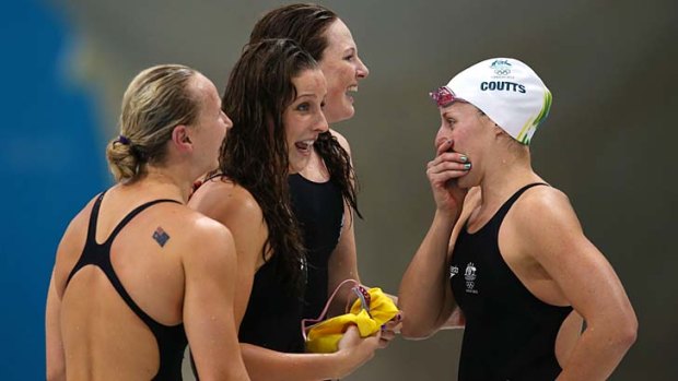 Olympic glory .... Brittany Elmslie, second left, has come from rock bottom to win gold. She is pictured with teammates, from left to right, Cate Campbell,  Melanie Schlanger and Alicia Coutts.