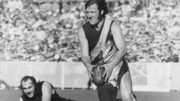 Triumph: Sheedy heads upfield in the 1973 grand final and there's nothing Carlton's Bruce Doull can do about it.