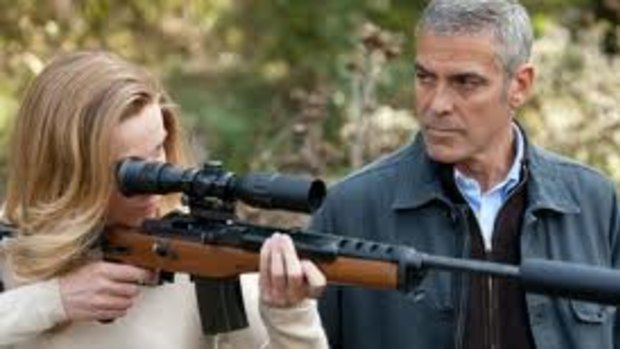George Clooney (right) can't sell himself as a cool, cold-hearted killer in the flat thriller The American.