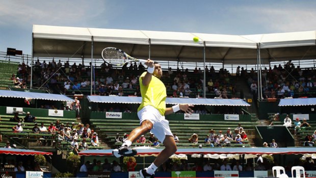 Jo-Wilfried Tsonga leaps for the ball during his win over Tommy Haas at Kooyong yesterday.