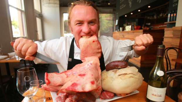 La Luna chef Adrian Richardson tucks into a pig's ear.