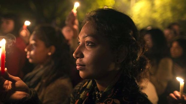 Standing together &#8230; demonstrators attend a vigil in December for the Delhi gang-rape victim.