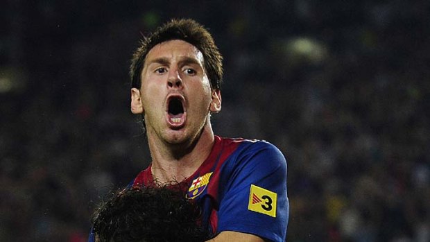 Scored the winner ... Lionel Messi, top, celebrates with Cesc Fabregas.