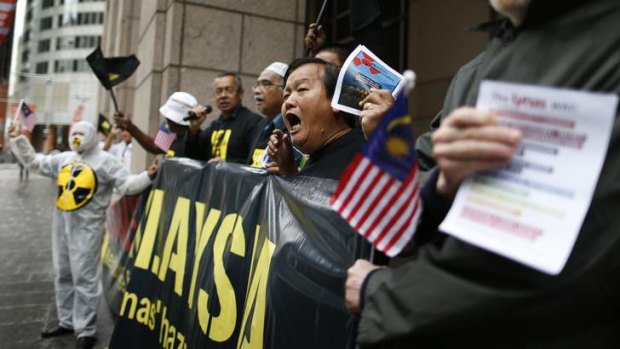 Members of the group 'Save Malaysia, Stop Lynas' protest outside the Lynas 2012 annual general meeting.