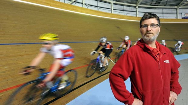 Richard Stringer of the Blackburn Cycling Club, watches over his young riders at the Darebin Indoor Sports Centre.