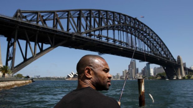 Gone fishin' . . . American boxing great Roy Jones jnr takes time out from training to wet a line on the harbour yesterday. Come Wednesday, he'll have bigger fish to fry when he meets Danny Green in the ring.
