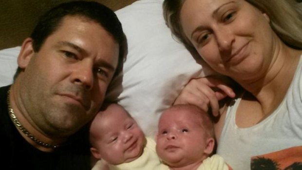 'Holed up in their motel': Kate and Adam Osborne with their baby girls Mali and Sierra-Leone