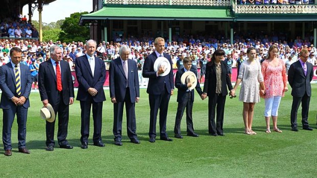 The Nine commentary team join Tony Greig's family - wife Vivian, sons Tom and Mark, and his daughters Beau and Samantha - to observe a minute's silence before the match.