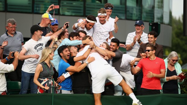Marcus Willis, of Great Britain, celebrates his unexpected victory against Ricardas Berankis, of Lithuania, on day one at Wimbledon.