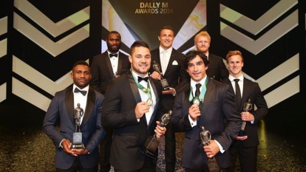 Jarryd Hayne and Johnathan Thurston pose with the Team of the Year at the Dally M Awards.