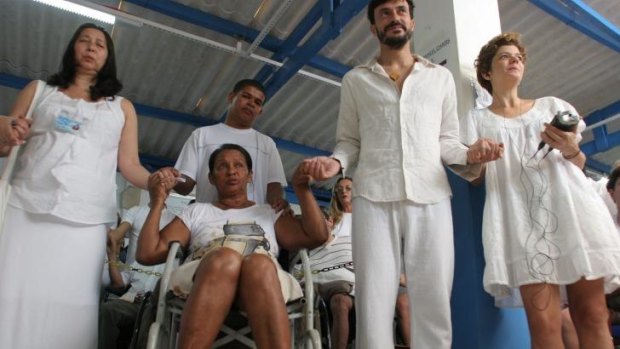 A wheelchair-bound patient waits to see Joao de Deus. 