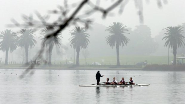All weather friend: A deep fog doesn't deter rowers on Albert Lake.