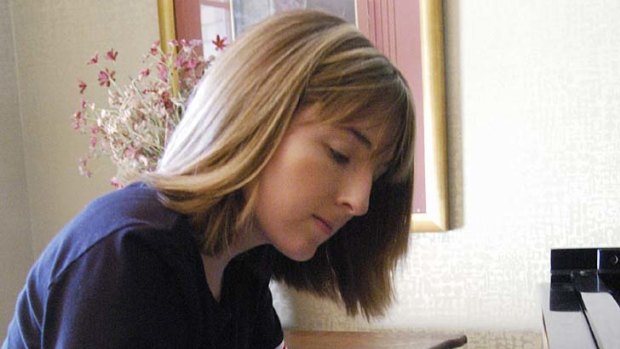 Hillary Adams practises the piano in this March 2005 photo.