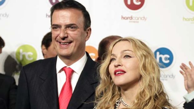 Friends in high places ... Mexico City Mayor Marcelo Ebrard, who has been been voted the world's best mayor, poses with US pop star Madonna.