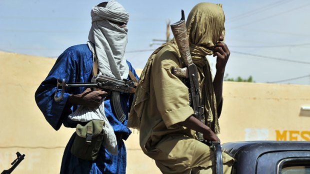 Two Islamist policemen patrol in the streets of Gao, northern Mali.