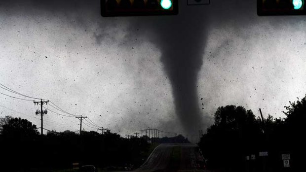A tornado touches down in Lancaster,  south of Dallas.
