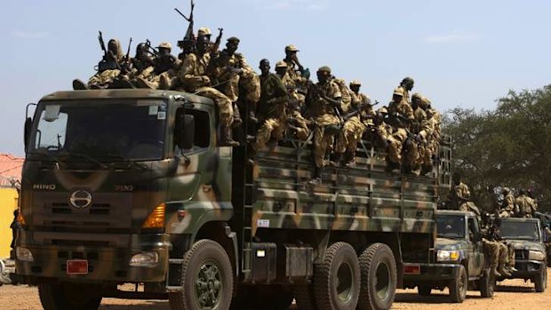 SPLA soldiers drive in a truck in South Sudan's capital, Juba.