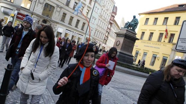 Marabel, a guide from the Corrupt Tour travel agency, shows tourists around  places tied with scandals in public tenders in central Prague.