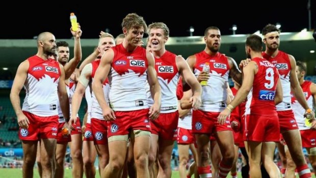 The Swans leave the field in triumph at the SCG on Saturday night after downing Fremantle.