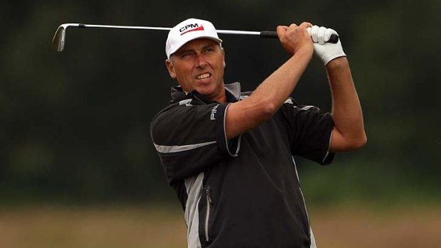Mike Harwood in action during the first round of the Senior Open Championship at Walton Heath Golf Club in Tadworth, England.