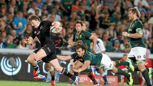 Beuden Barrett of the All Blacks breaks clear to score the championship- winning try.