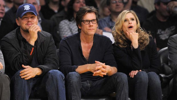 Off screen ... actors Leonardo DiCaprio, left, Kevin Bacon and Kyra Sedgwick at a basketball game.
