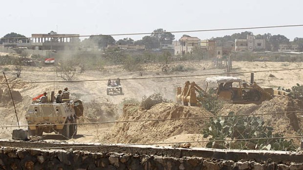 Egyptian soldiers use bulldozers in search of tunnels on the border with Egypt and the Gaza Strip on September 8, 2013.