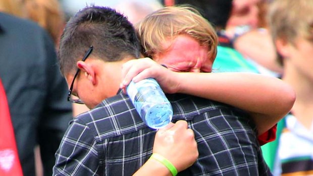Tearful: Emotional scenes as family and friends see off Jake Kedzlie.