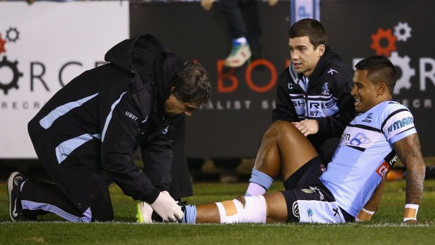 Ouch: Ben Barba grimaces as he receives attention.