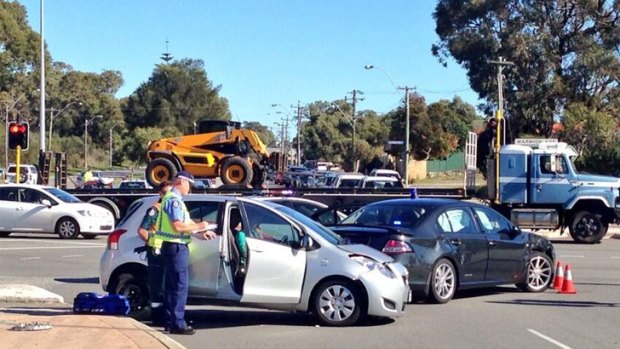 An unmarked police car collided with the other car at an intersection of West Coast Highway.