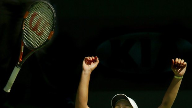 Justine Henin celebrates after winning the Australian Open women's final in 2004.