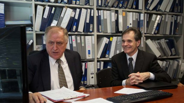 Queensland father Ron Williams (right) and his solicitor Claude Bilinsky react to the High Court ruling today.