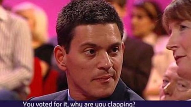 Change of mind ... David Miliband challenges Harriet Harman for applauding his brother's condemnation of  the Iraq war.