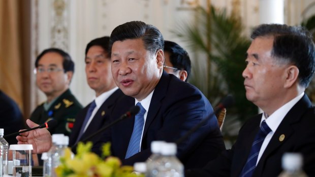 Chinese President Xi Jinping, joined by Chinese Vice Premier Wang Yang, right, speaks during a bilateral meeting with President Donald Trump.