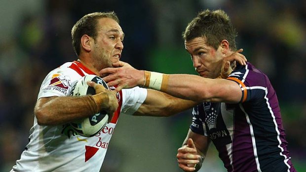In arms way: Dragon Jason Nightingale fends off Storm's Anthony Quinn last night.