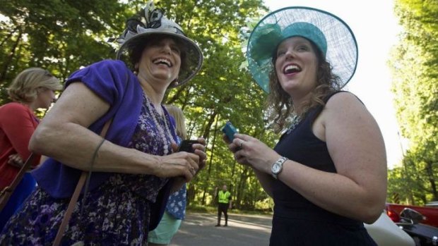 Laura Fenton (right) and her mother Rochelle Fenton await the arrival of Prince William and Prince Harry at Guy Pelly's wedding on Saturday.  