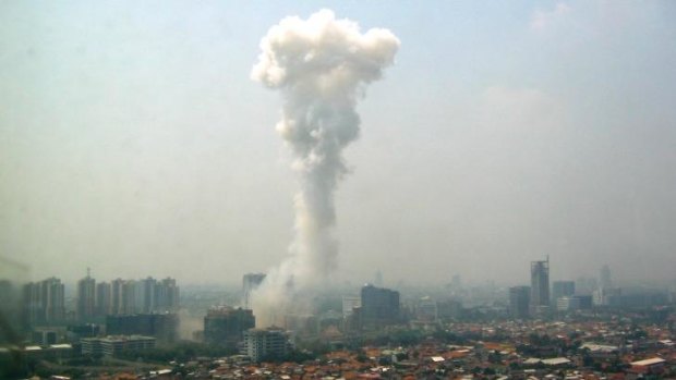 Smoke billows following a blast outside the Australian embassy in Jakarta on September 9, 2004.