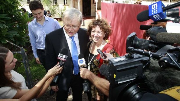 Kevin Rudd and Therese Rein meet the media outside church in Bulimba, Queensland.