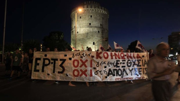 Protesters march in solidarity with employees of Greek state broadcaster ERT in Thessaloniki.