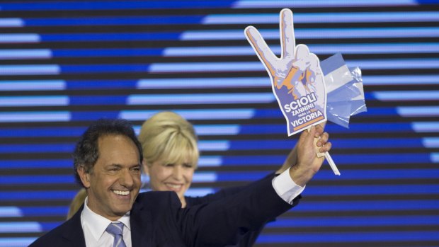 Governor of the Buenos Aires province and Argentina presidential candidate Daniel Scioli and his wife Karina Rabolini.