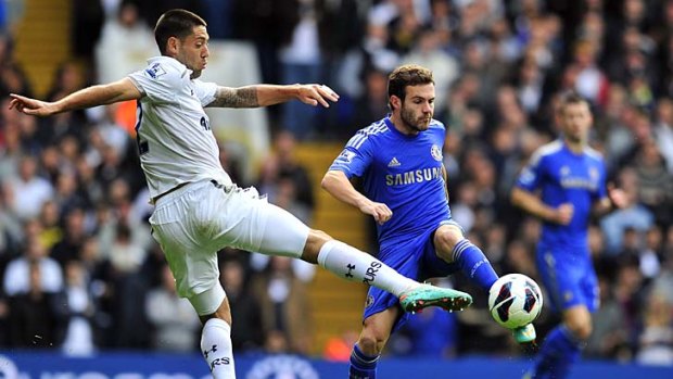 Tottenham Hotspur's US striker Clint Dempsey (left) vies for the ball with Chelsea's Spanish midfielder Juan Mata when the two teams met yesterday.