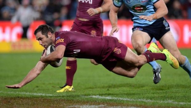 First blood: Maroons skipper Cameron Smith dives over for the first try of the night.