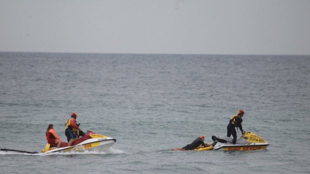 The search for the body of a missing man at Wybung Head on the central coast.