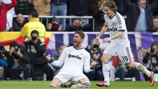 Real Madrid's Sergio Ramos (left) celebrates with Luka Modric after scoring against Barcelona.