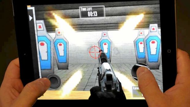 A man playing the newly released National Rifle Association  iPhone/iPad app "NRA: Practice Range''.