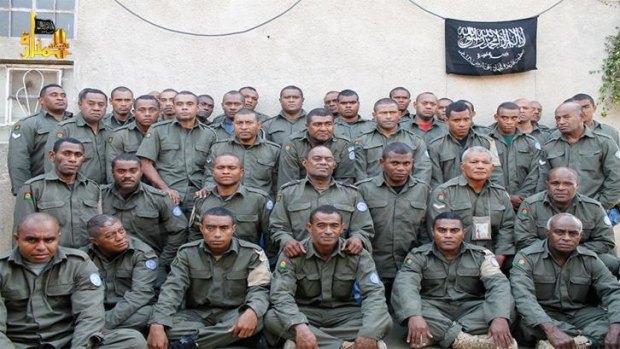 This photo, tweeted by an al-Qaeda linked Syrian rebel group on 31 August, is thought to show 38 of the 45 Fiji soldiers they are holding prisoner at an unknown location.