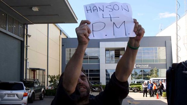 Aiming even higher ... a Hanson supporter waits for his hero.