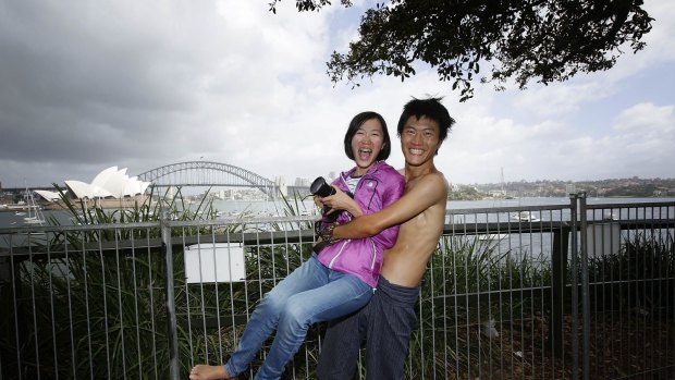 Cheng-Yen Chen and his sister Wer Yu Chen from Tiawan where the first people to queue and camp out at the Domain to get a prime position at Lady Macquaries Chair, on December 31, 2014 in Sydney, Australia. Cheng- Yen had been camped out at the Domain since 5pm on Monday.